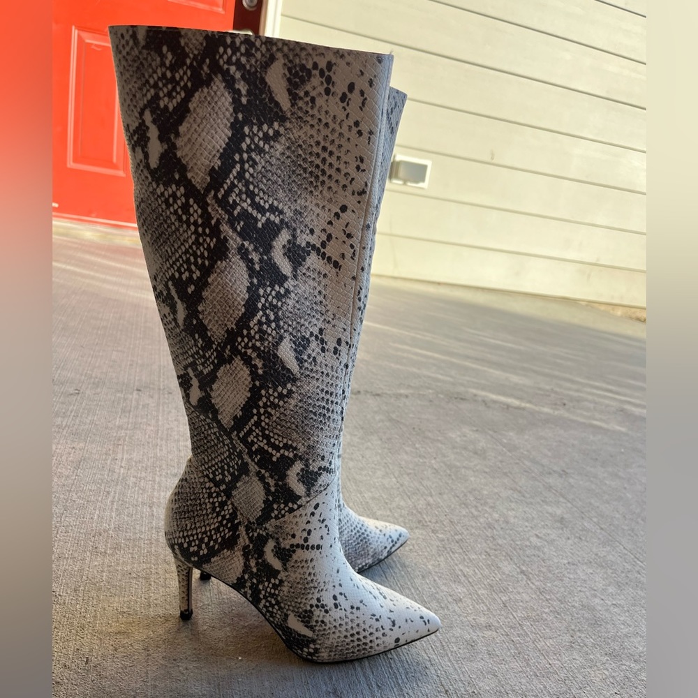 Knee high snake print boots. Gently used, great condition